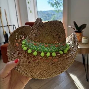 Cute cowboy hat with green tassels